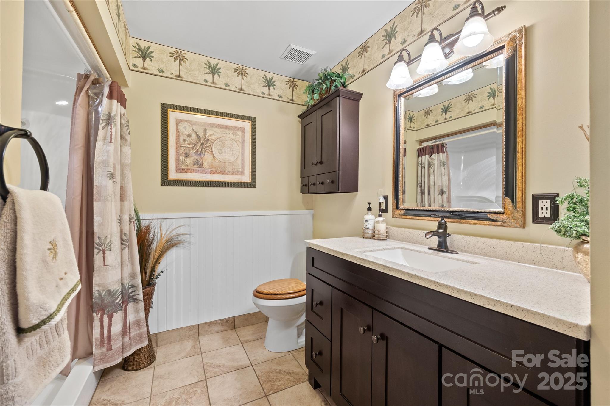 27056 Catamaran Drive Tega Cay, SC 29708 - Photo 14 of 48 a bathroom with a sink a toilet and mirror