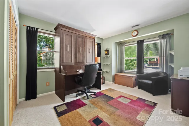 a workspace with furniture and a window