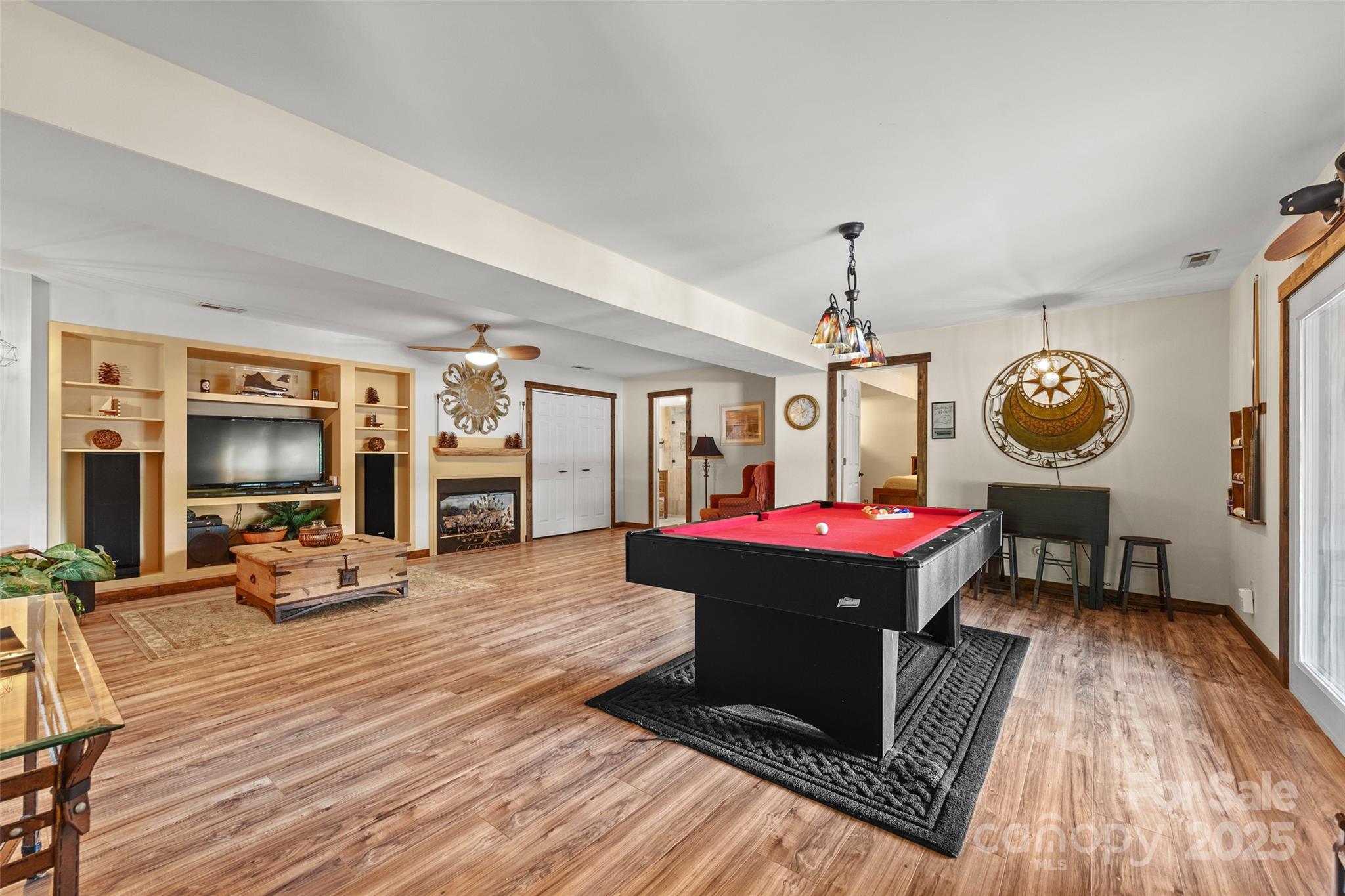27056 Catamaran Drive Tega Cay, SC 29708 - Photo 24 of 48 a living room with furniture a flat screen tv and a fireplace