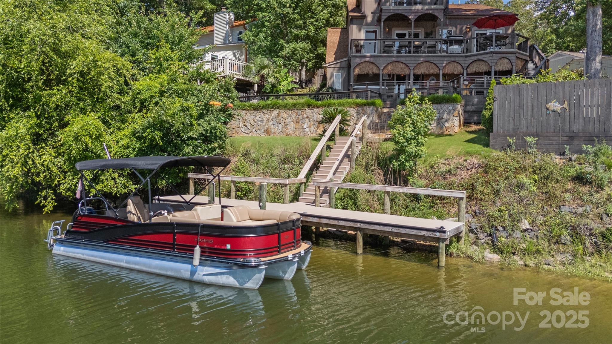 27056 Catamaran Drive Tega Cay, SC 29708 - Photo 31 of 48 a small pool with lawn chairs next to a yard