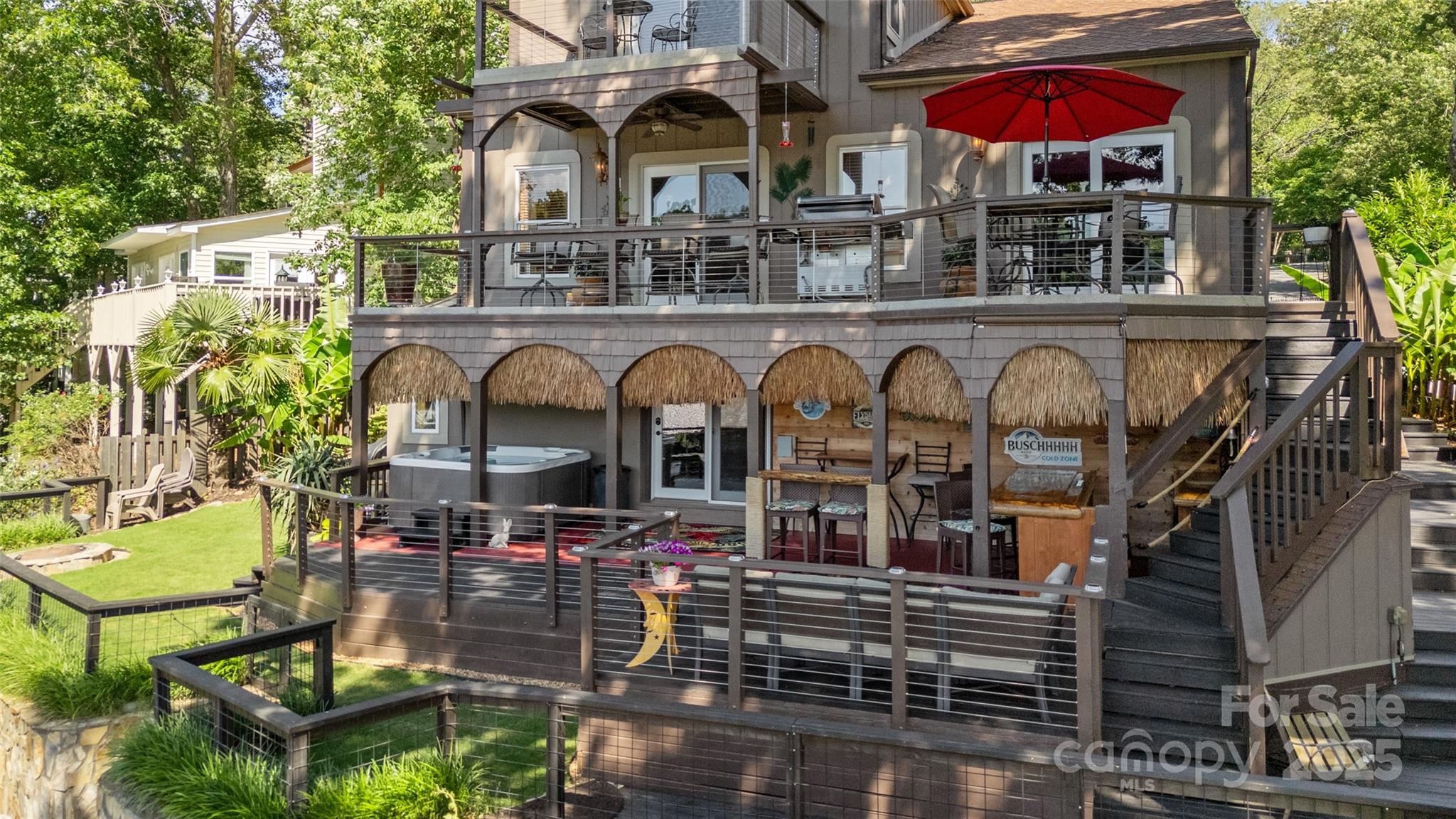 27056 Catamaran Drive Tega Cay, SC 29708 - Photo 32 of 48 a front view of a building with glass windows and a table