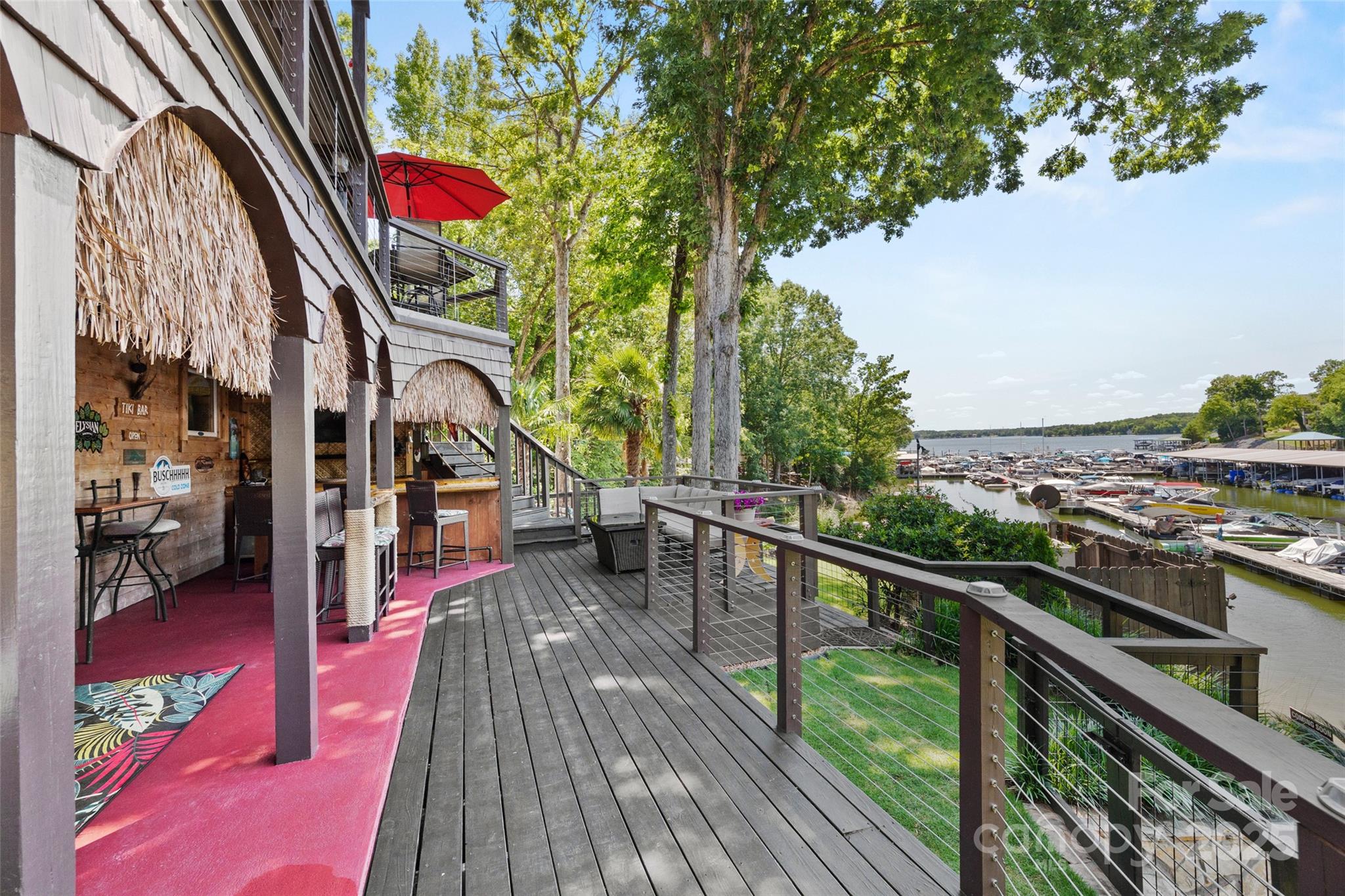 27056 Catamaran Drive Tega Cay, SC 29708 - Photo 36 of 48 a view of a balcony with wooden floor and outdoor seating