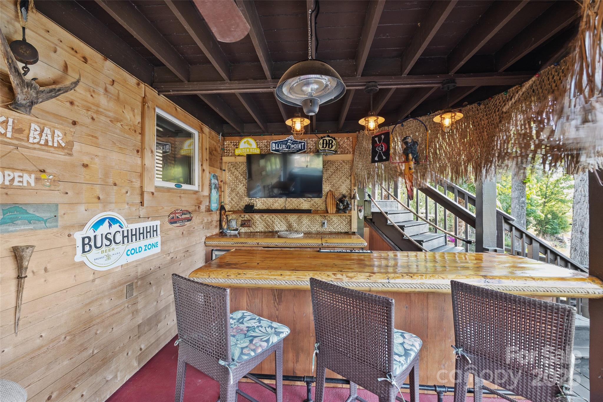 27056 Catamaran Drive Tega Cay, SC 29708 - Photo 37 of 48 a room with a table chairs and a chandelier