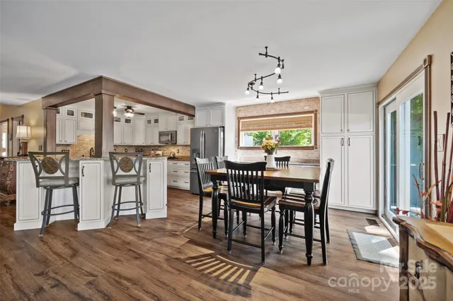 a view of a dining room with furniture and window