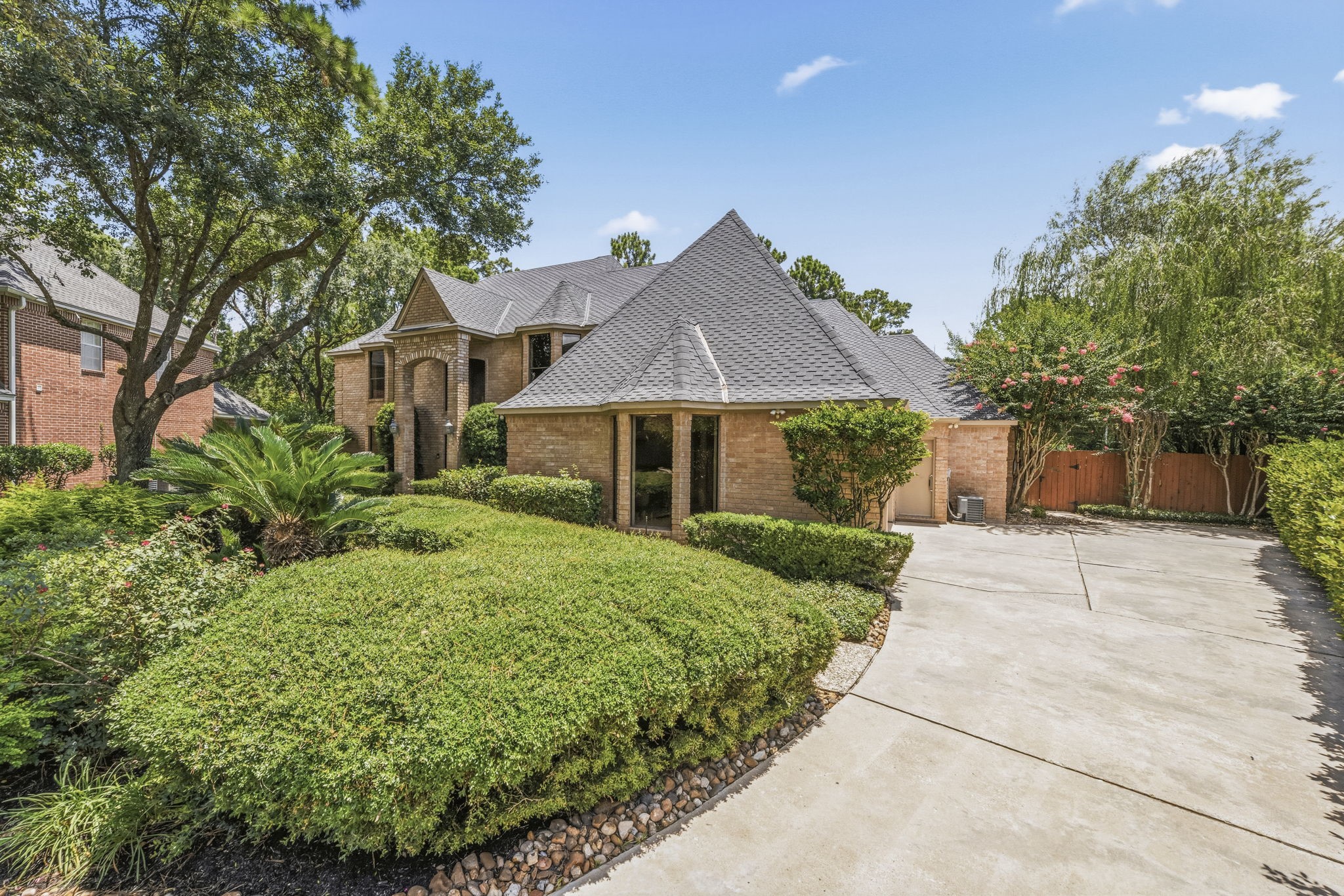 18503 Cabaniss Circle Spring, TX 77379 - Photo 6 of 49 The side-entry garage and long driveway provide ample parking while preserving the home's stately front elevation and timeless curb appeal.