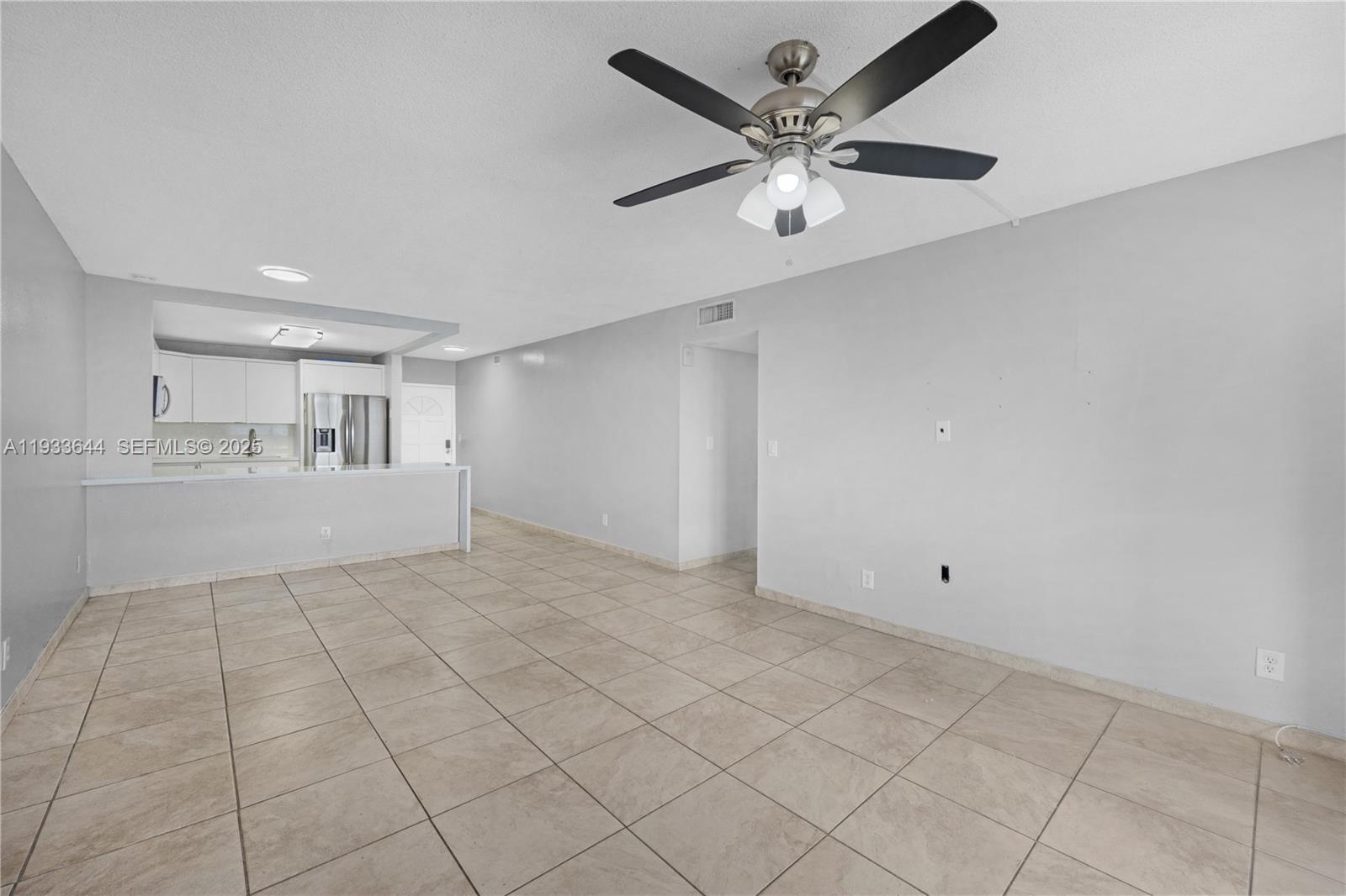 1750 West 46th Street, Unit 544 Hialeah, FL 33012 - Photo 11 of 44 a view of an empty room with a window