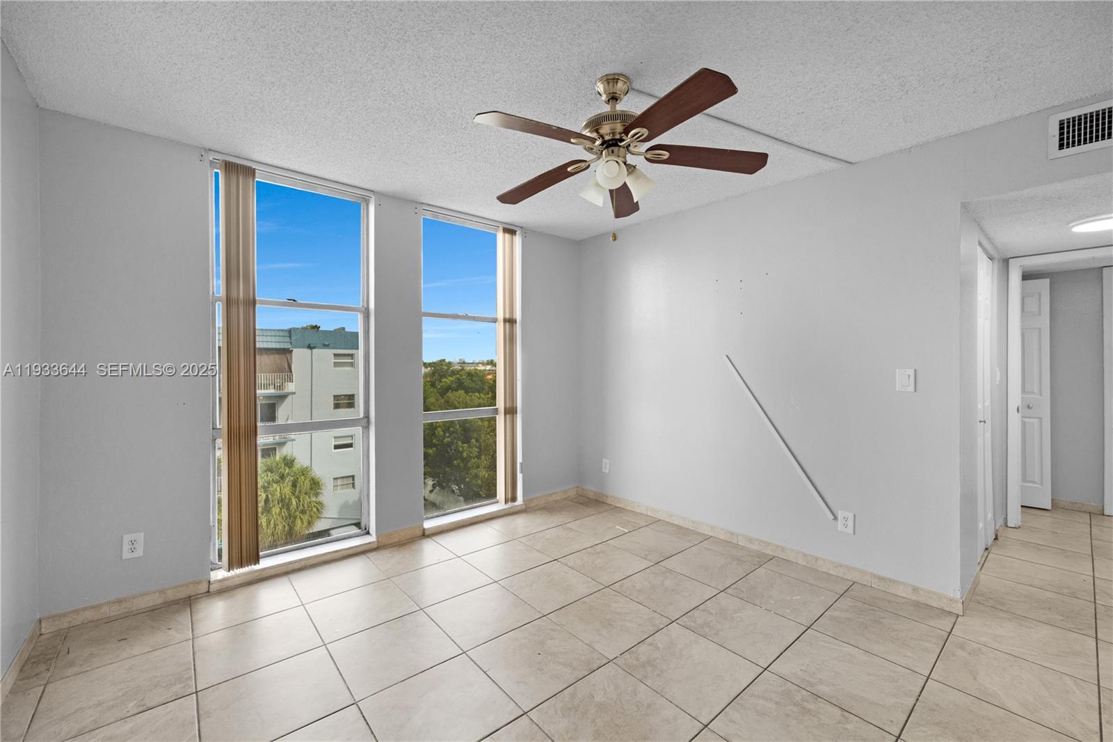 1750 West 46th Street, Unit 544 Hialeah, FL 33012 - Photo 23 of 44 a view of an empty room with a window