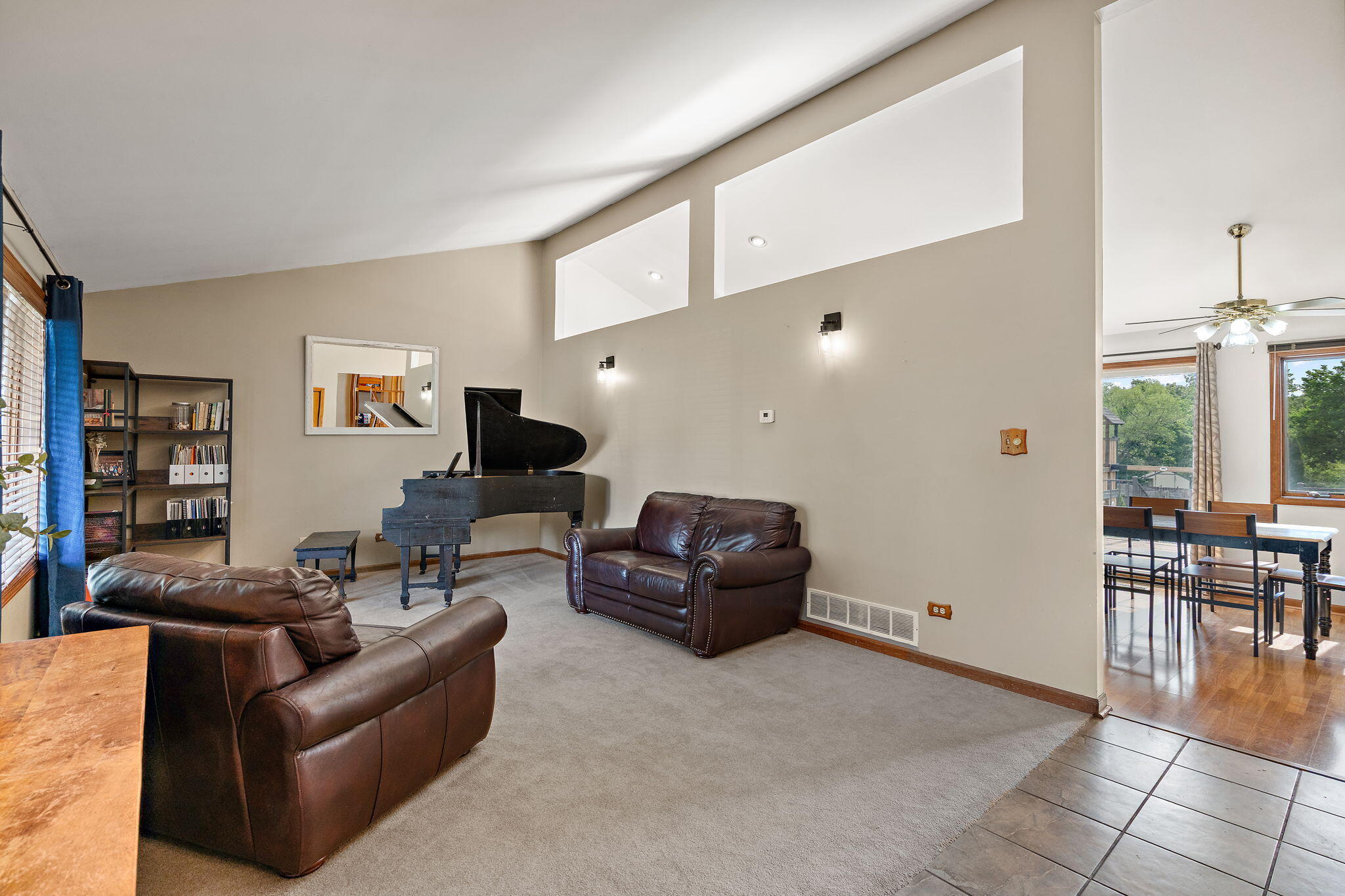 8987 Calhoun Place Crown Point, IN 46307 - Photo 5 of 28 a living room with furniture and a large window