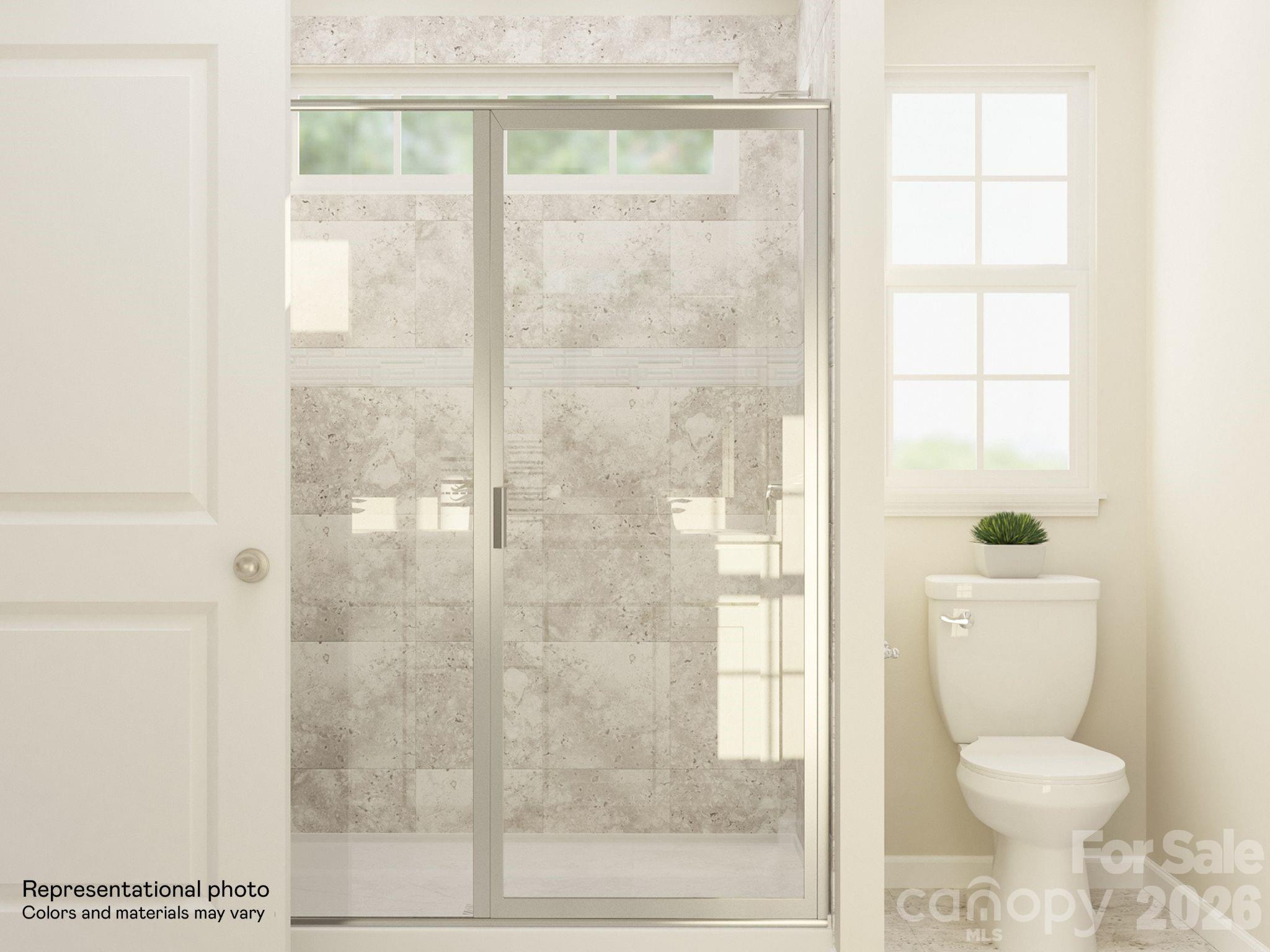 7002 Juneberry Way Maiden, NC 28650 - Photo 22 of 25 a bathroom with a toilet and a shower
