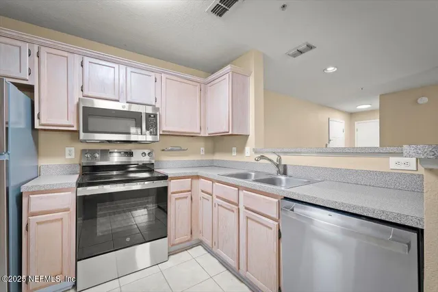 a view of storage and utility room with washer and dryer
