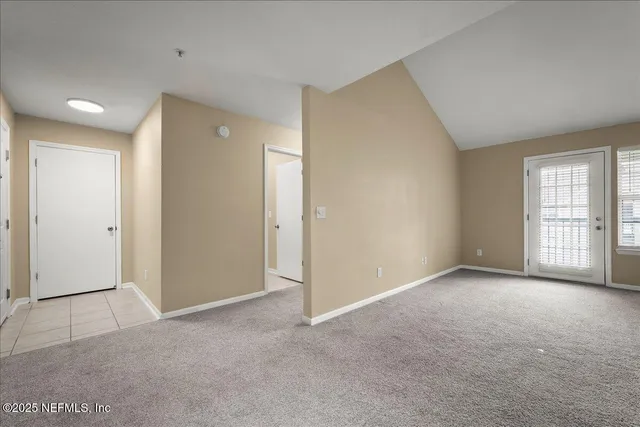 a view of a kitchen with a refrigerator