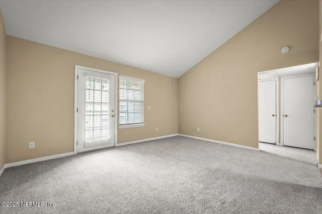 a view of an empty room with a window