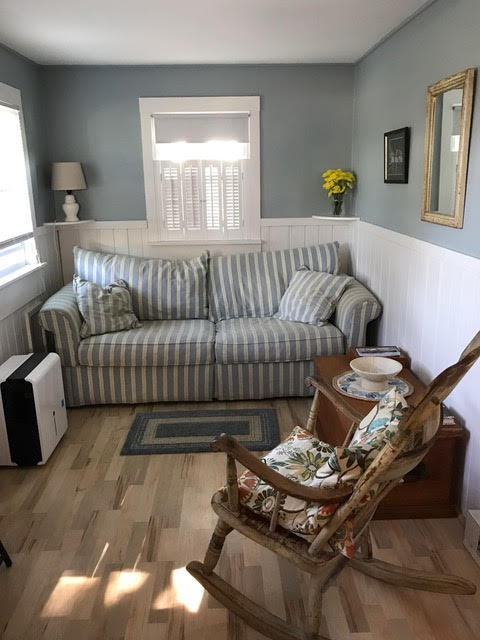 125 Shore Road, Unit 1 Truro, MA 02666 - Photo 4 of 8 a living room with furniture