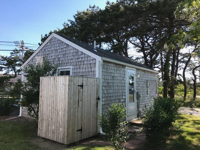 125 Shore Road, Unit 1 Truro, MA 02666 - Photo 5 of 8 a house view with a backyard space