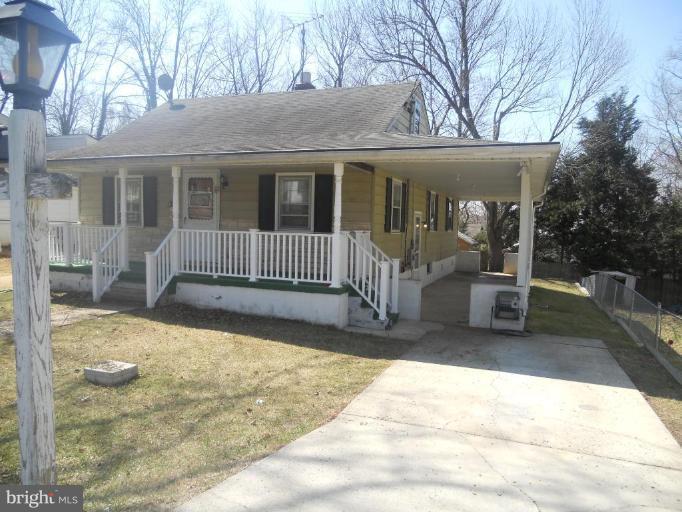 11700 Idlewood Road Silver Spring, MD 20906 - Photo 13 of 17 a view of a house with backyard and porch