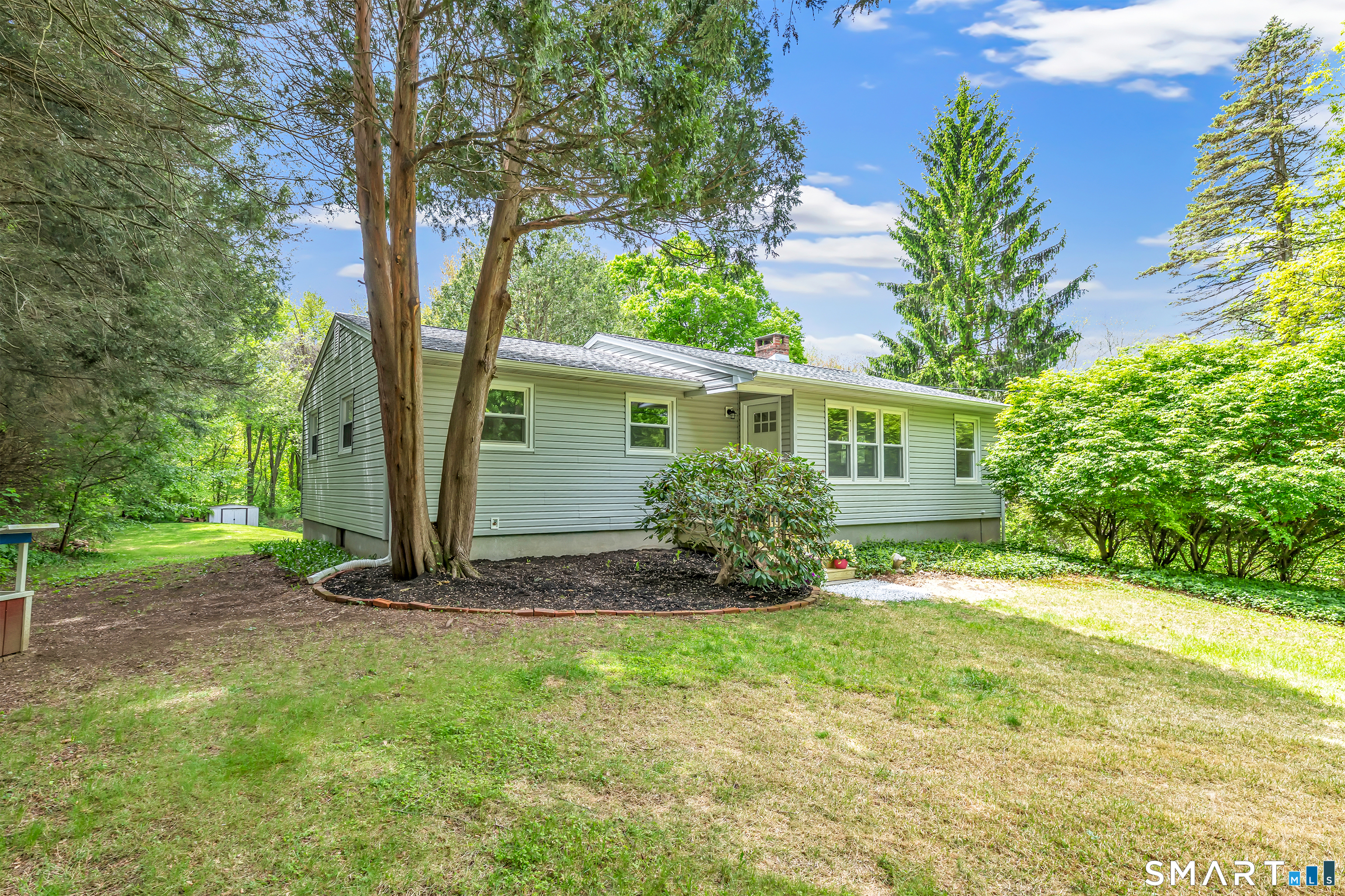 7 Longview Road Newtown, CT 06482 - Photo 1 of 40 a view of a house with backyard and garden