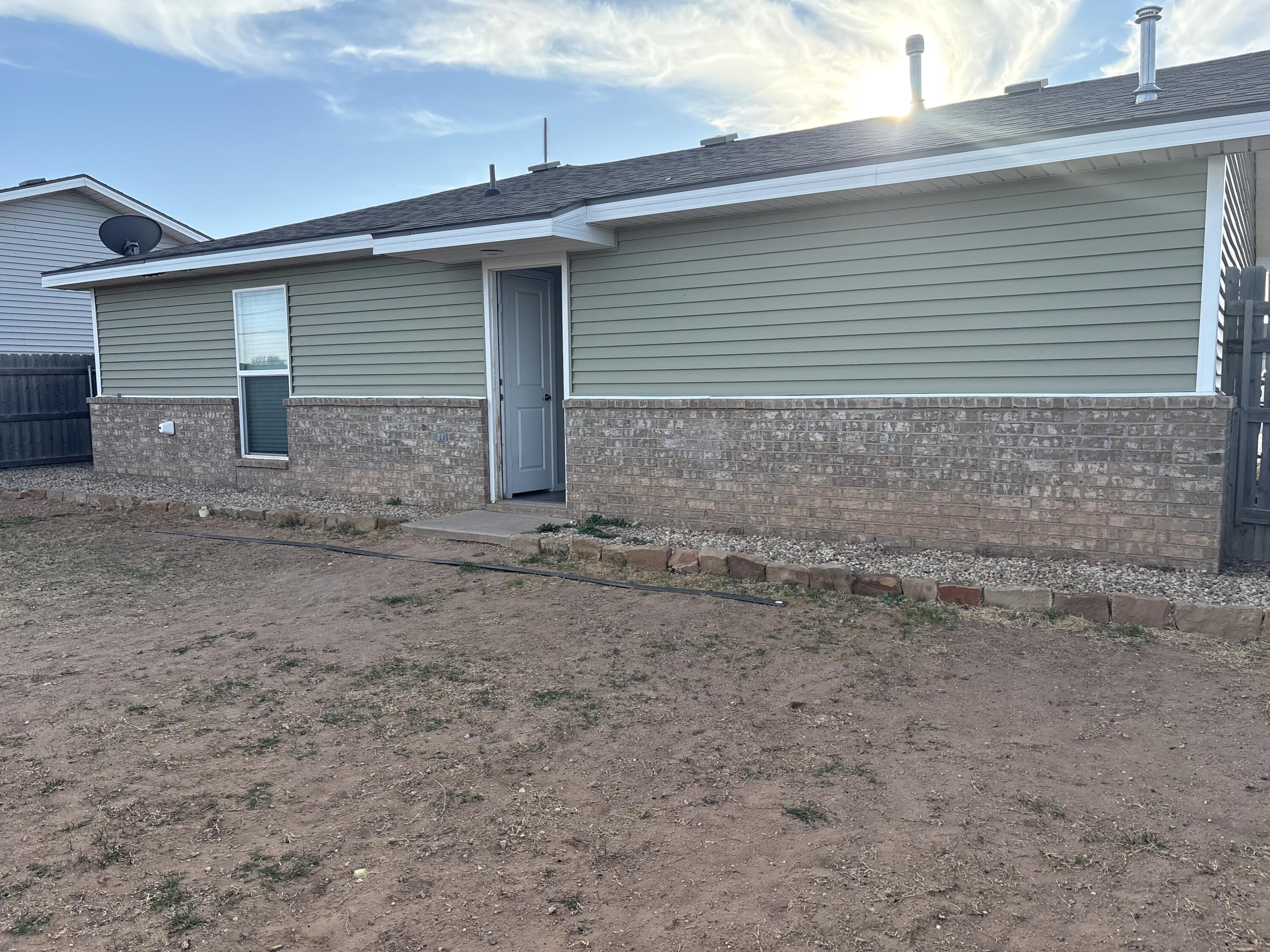 13809 Paris Lubbock, TX 79423 - Photo 12 of 19 a view of house with backyard space