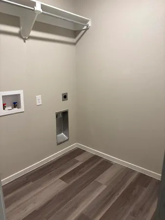 a room with a hardwood and ceiling fan