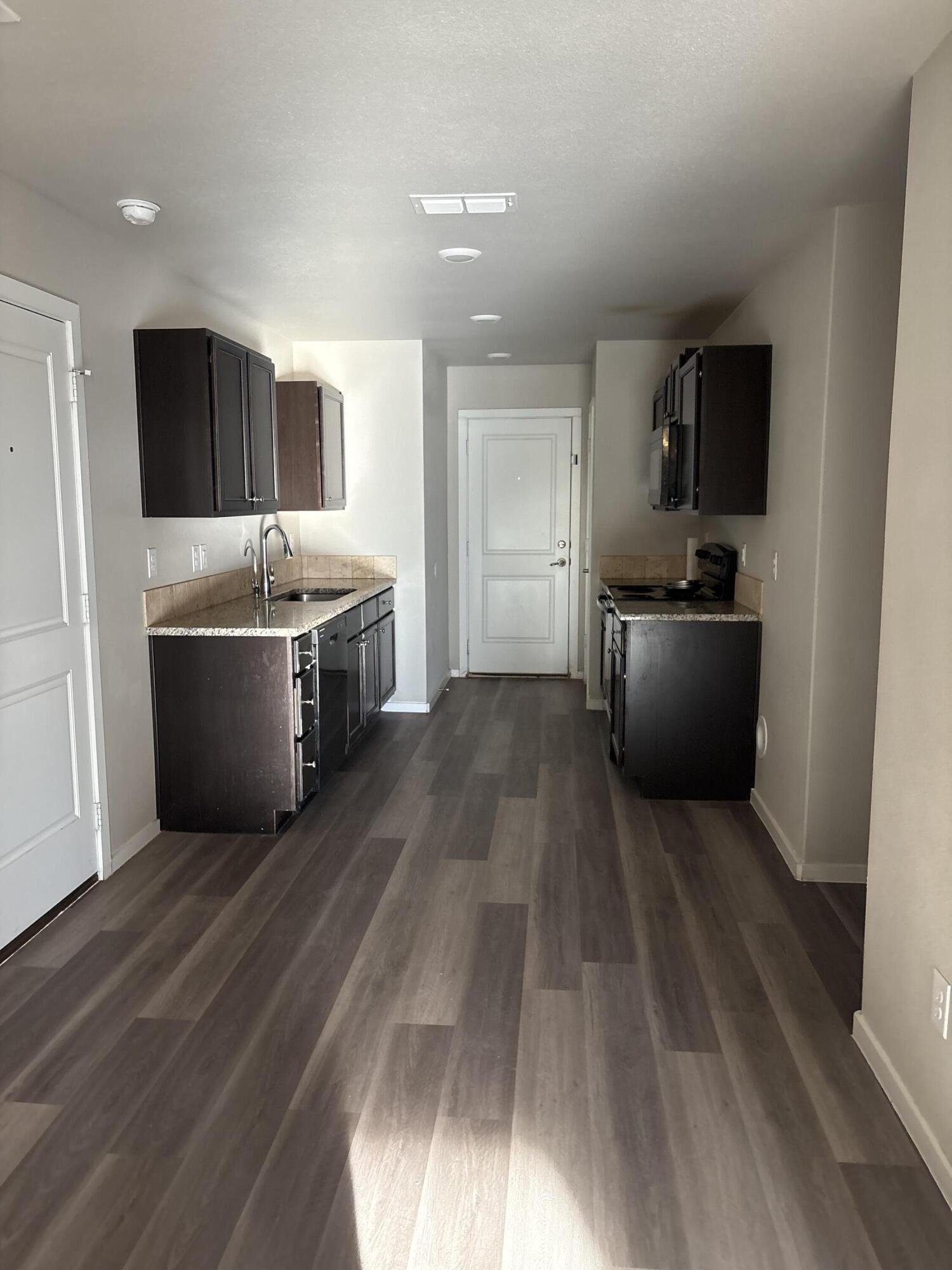 13809 Paris Lubbock, TX 79423 - Photo 16 of 19 a large kitchen with a sink and stainless steel appliances