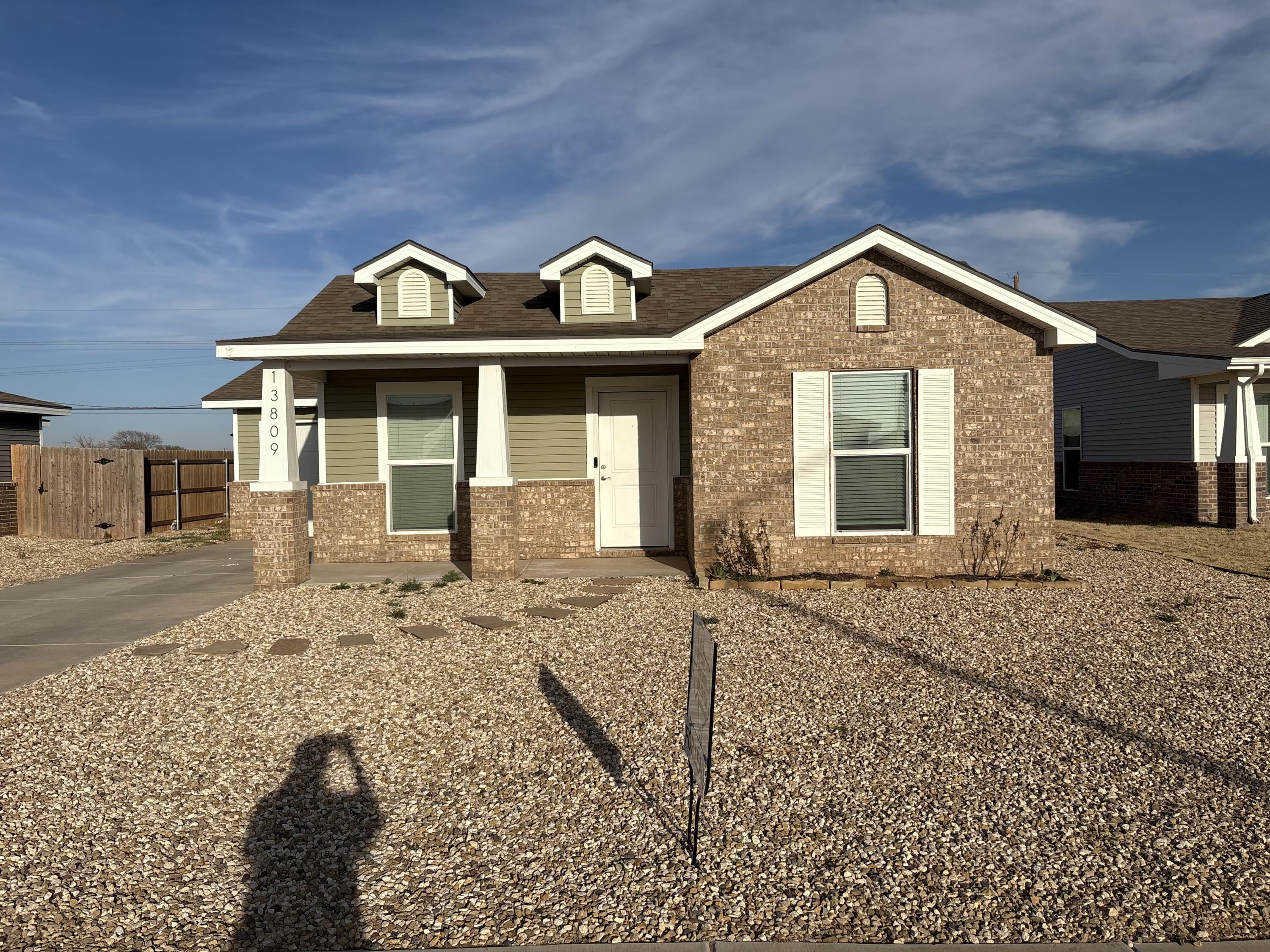 13809 Paris Lubbock, TX 79423 - Photo 19 of 19 a front view of a house with a yard