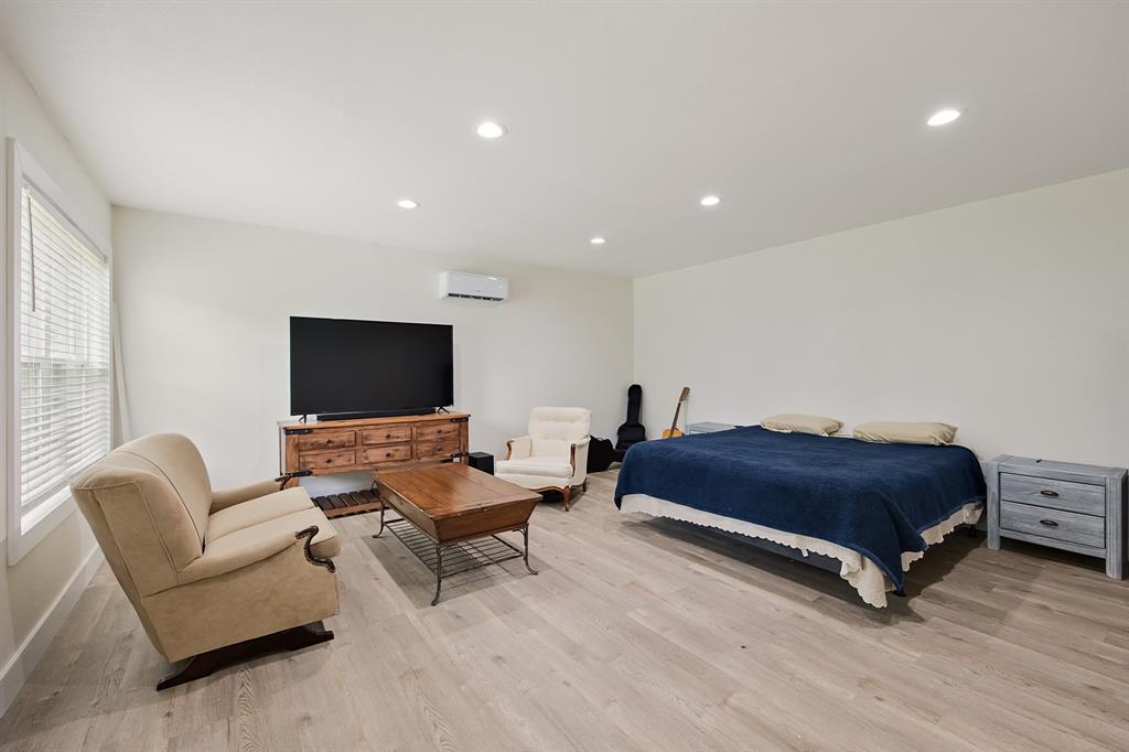 114 Ricky Road Gun Barrel City, TX 75156 - Photo 17 of 18 Spacious room featuring light wood-finish flooring, recessed lighting, and a wall-mounted mini-split system