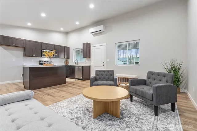 a kitchen with stainless steel appliances kitchen island granite countertop a sink and a granite counter tops