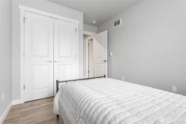 a large white bed in a white room