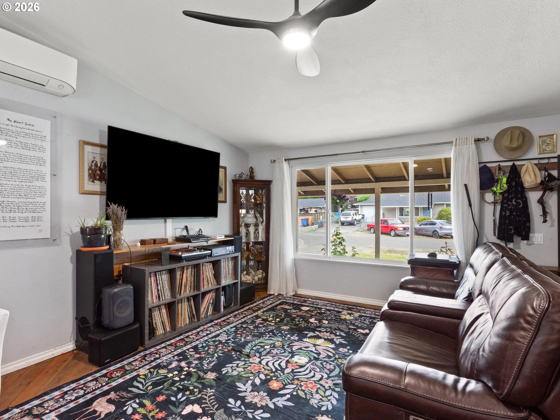 1719 Southwest 1st Street Battle Ground, WA 98604 - Photo 11 of 37 a living room with furniture and a flat screen tv