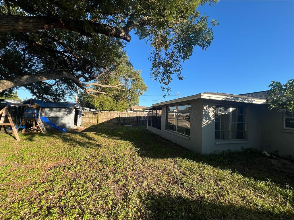 7539 Marechal Avenue Port Richey, FL 34668 - Photo 13 of 13 a view of a house with a yard
