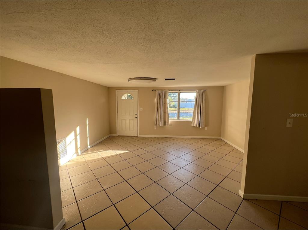 7539 Marechal Avenue Port Richey, FL 34668 - Photo 5 of 13 a view of an empty room and window