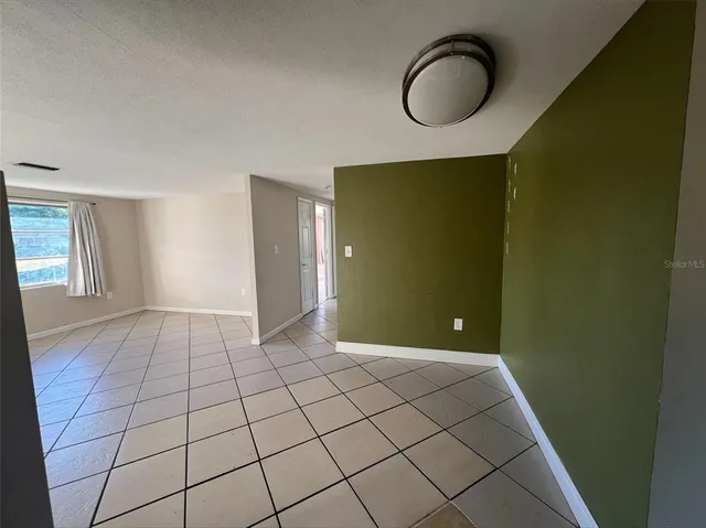 a view of an empty room and window