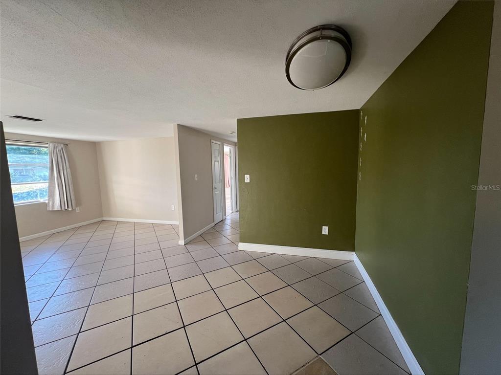 7539 Marechal Avenue Port Richey, FL 34668 - Photo 8 of 13 a view of an empty room and window