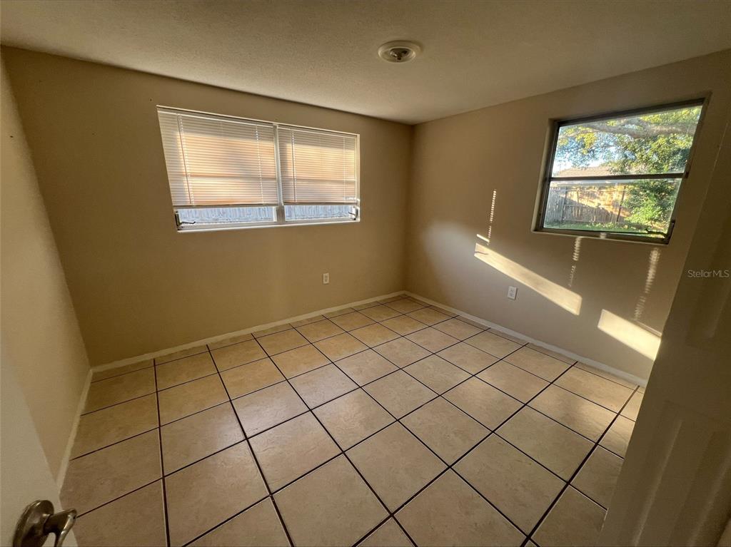 7539 Marechal Avenue Port Richey, FL 34668 - Photo 10 of 13 a view of an empty room and window