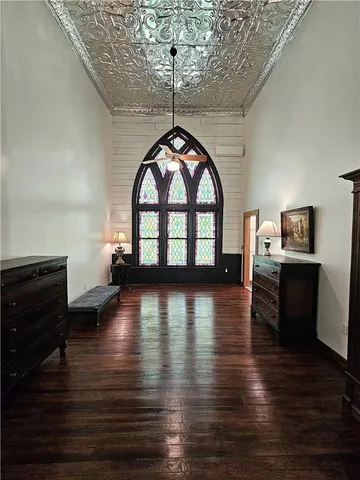 a bathroom with a granite countertop sink a toilet and shower