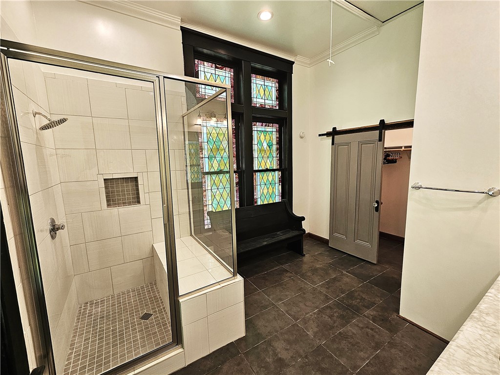 1100 South Tyler Street Thornton, TX 76687 - Photo 16 of 26 a bathroom with a tub and a shower