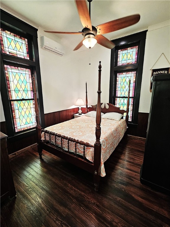 1100 South Tyler Street Thornton, TX 76687 - Photo 18 of 26 a bedroom with a bed a dresser next to a window