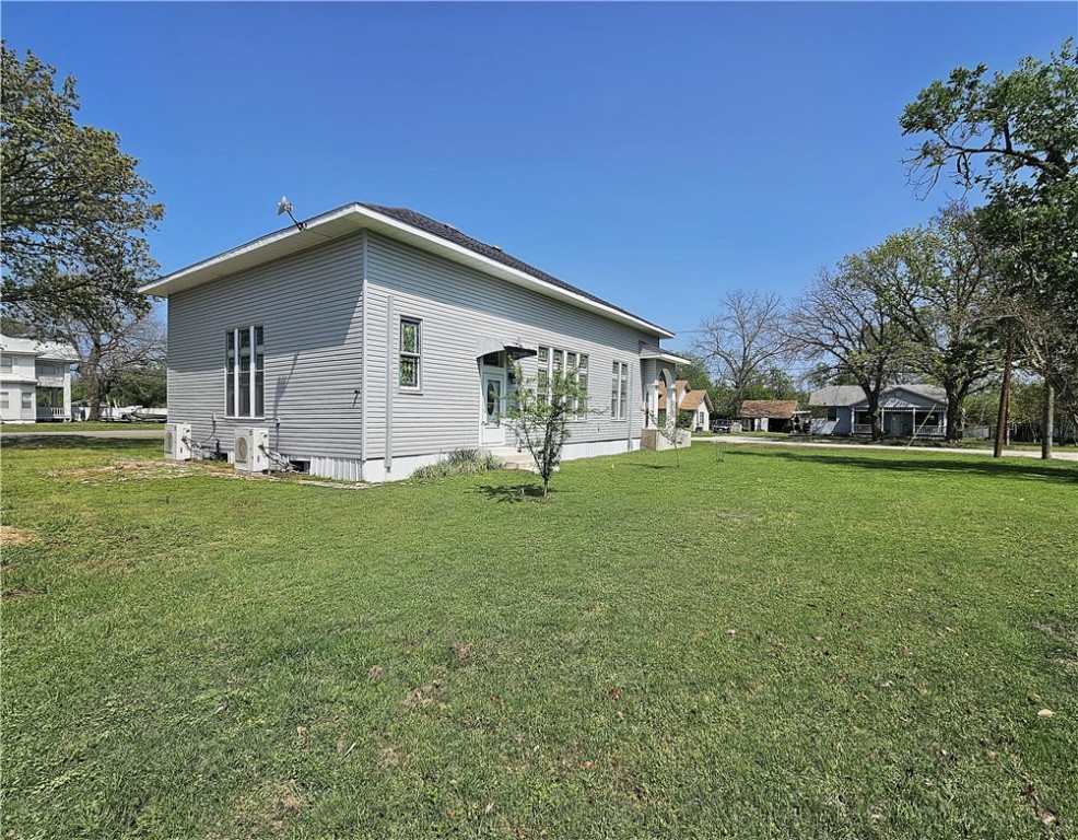 1100 South Tyler Street Thornton, TX 76687 - Photo 23 of 26 a view of a house with a yard