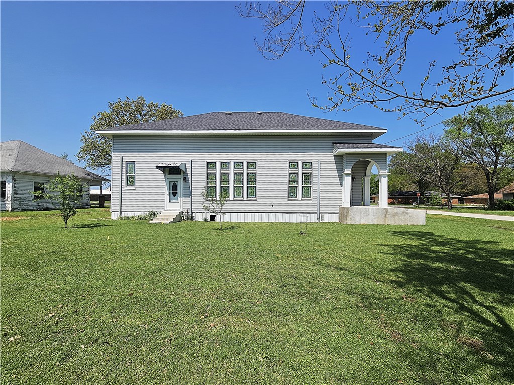 1100 South Tyler Street Thornton, TX 76687 - Photo 24 of 26 a front view of a house with a garden