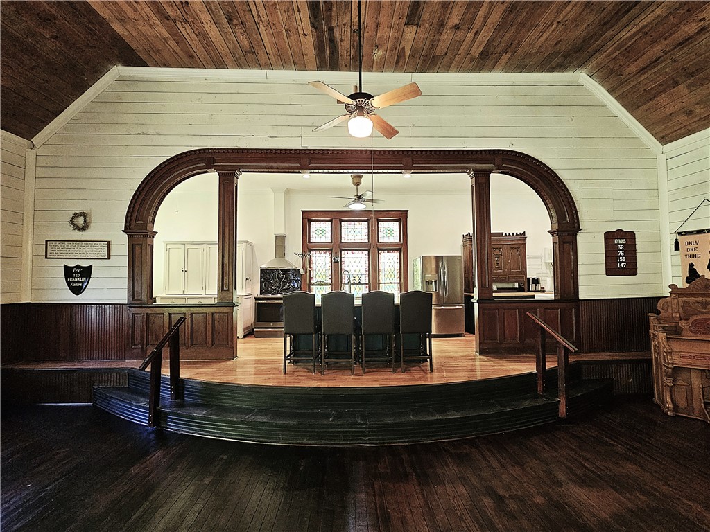 1100 South Tyler Street Thornton, TX 76687 - Photo 4 of 26 a living room with furniture and wooden floor