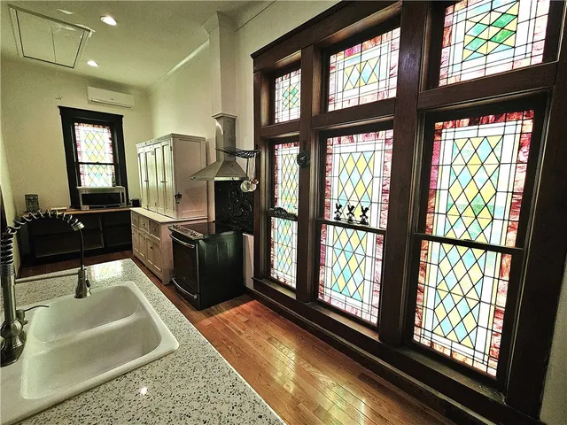 a kitchen with wooden cabinets and a stove top oven
