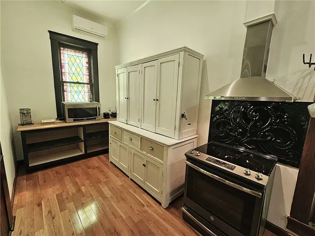 a view of hall way with furniture