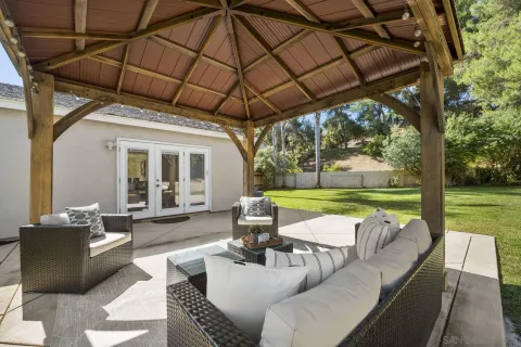 a view of yard with patio