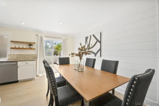 a view of a dining room with furniture and window