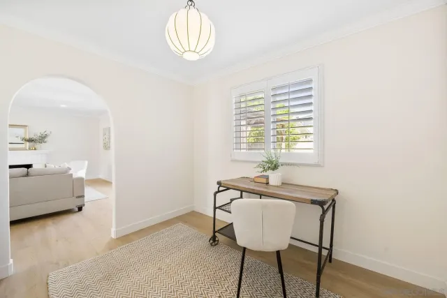 a dining room with furniture and window