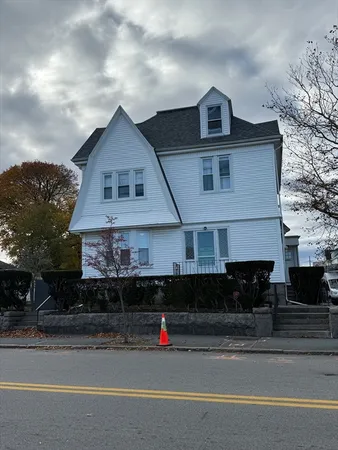 a front view of a house with a garage