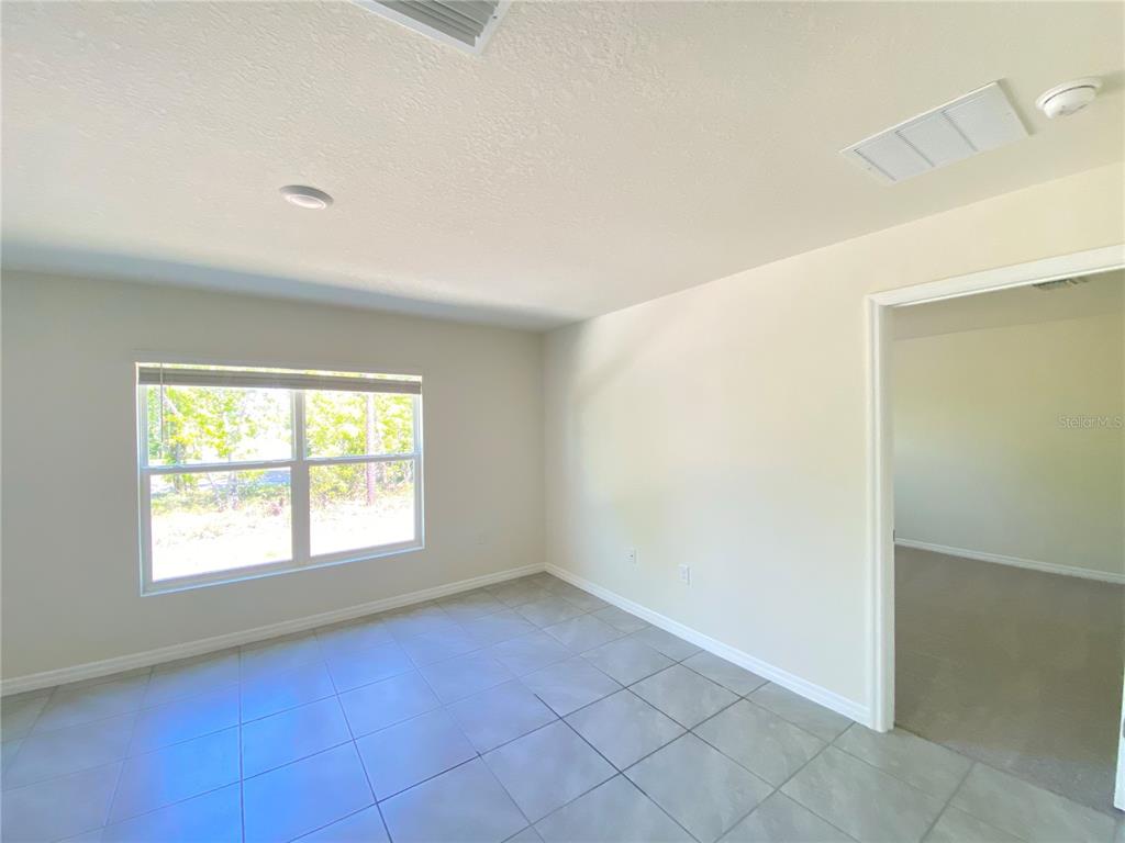 492 Hickory Course Loop Ocala, FL 34472 - Photo 10 of 28 an empty room with a window
