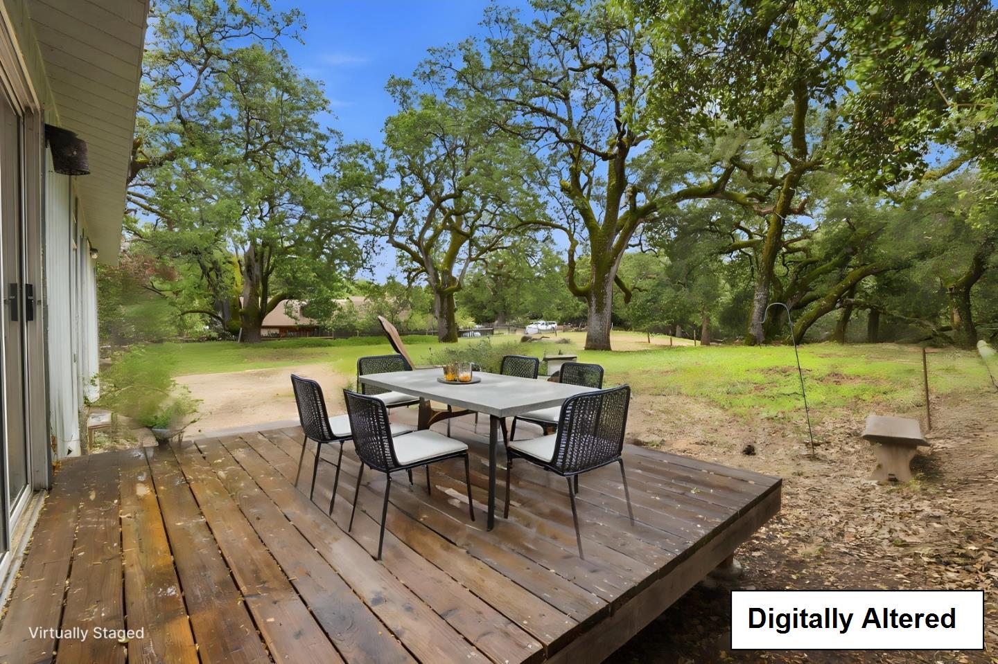 41800 Tassajara Road Carmel Valley, CA 93924 - Photo 15 of 51 a view of a backyard with table and chairs