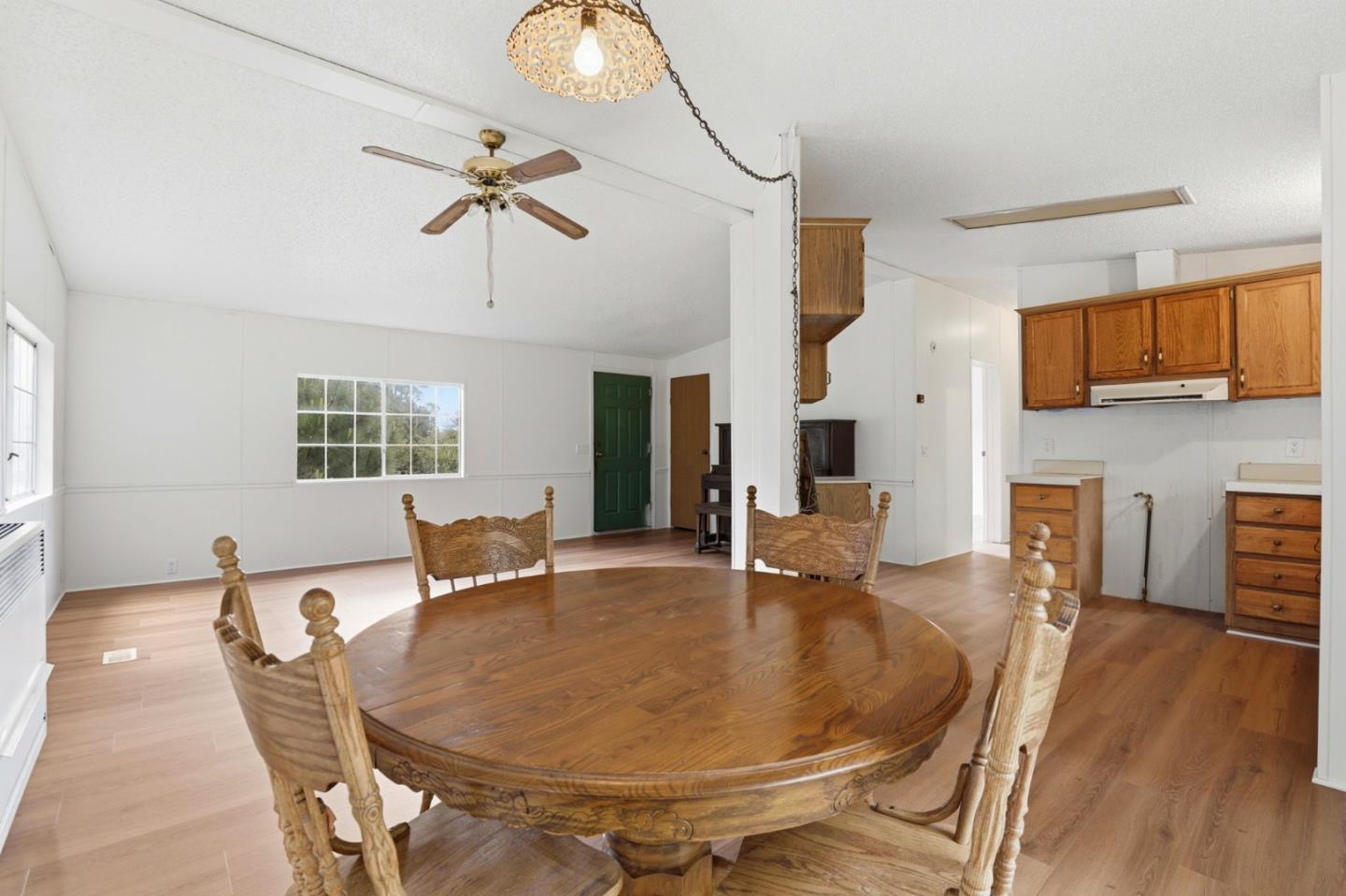 41800 Tassajara Road Carmel Valley, CA 93924 - Photo 16 of 51 a dining room with furniture and window