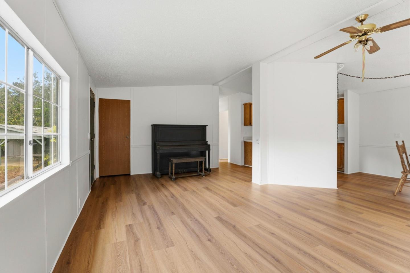 41800 Tassajara Road Carmel Valley, CA 93924 - Photo 18 of 51 a view of empty room with a fireplace and wooden floor