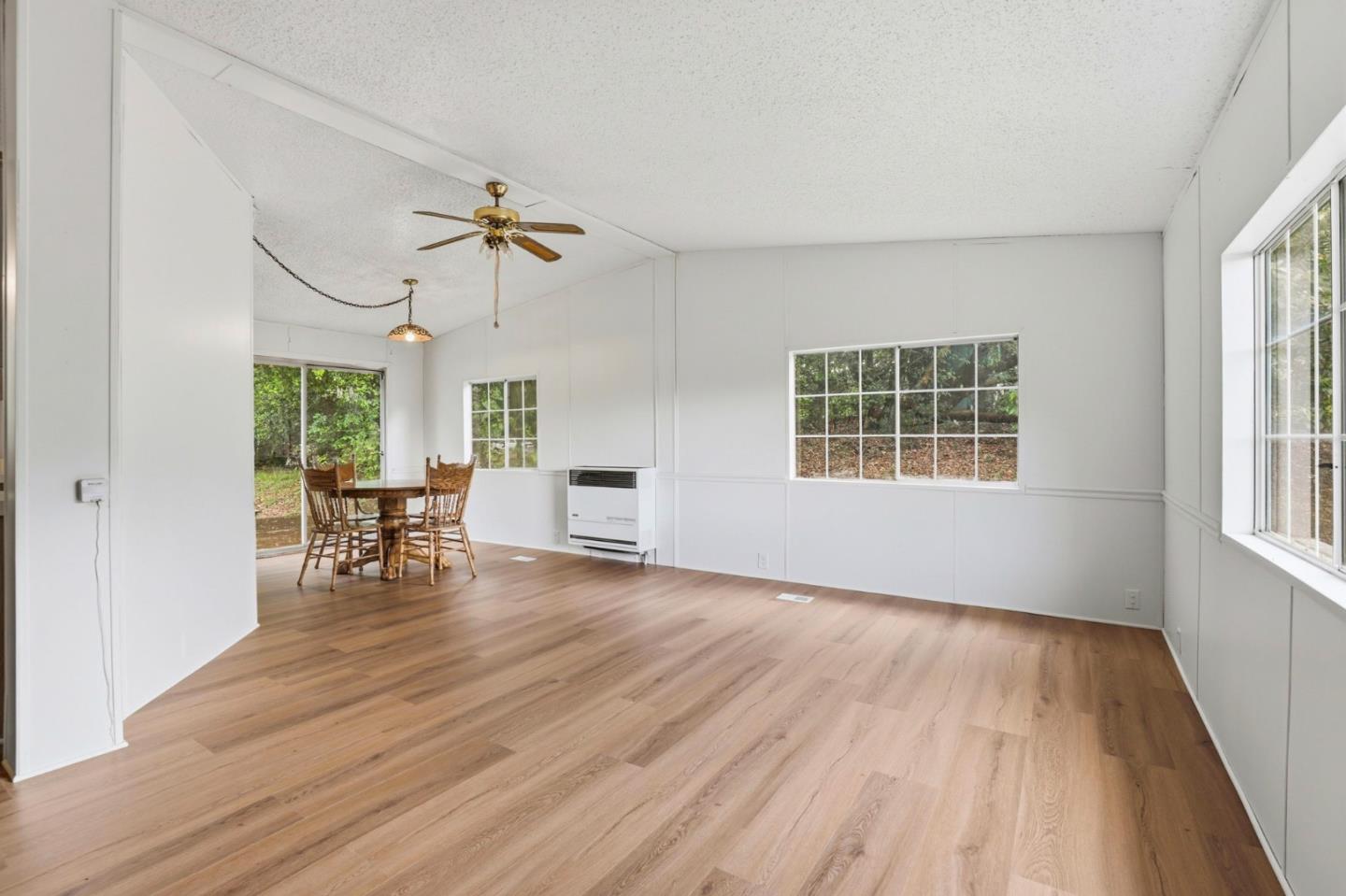41800 Tassajara Road Carmel Valley, CA 93924 - Photo 20 of 51 a view of a livingroom with furniture window and wooden floor
